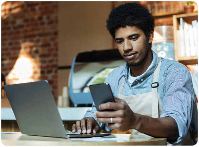 A guy on the mobile phone checking his inventory
